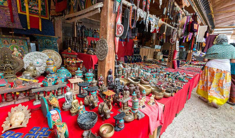 Bhutan handicrafts market in Thimphu, showcasing colorful souvenirs, jewelry, and traditional Bhutanese art for tourists.